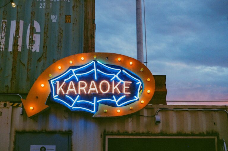 a large neon sign on the side of a building